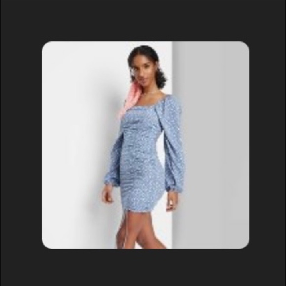 Blue dress that scrunches on the side to perfectly hug the curves!
